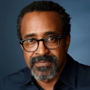 Hire celebrity comedian TIm Meadows in a black shirt and black glasses and goatee.
