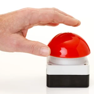 Close up image of hand about to press a red buzzer to promote Friendly Feud with The Comedian Company.